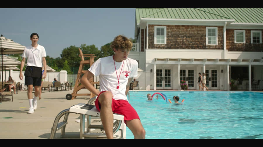 Lifeguard Watching Over Pool Wallpaper