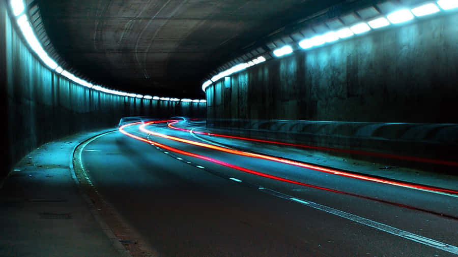 Light Trailsin Dark Tunnel Wallpaper