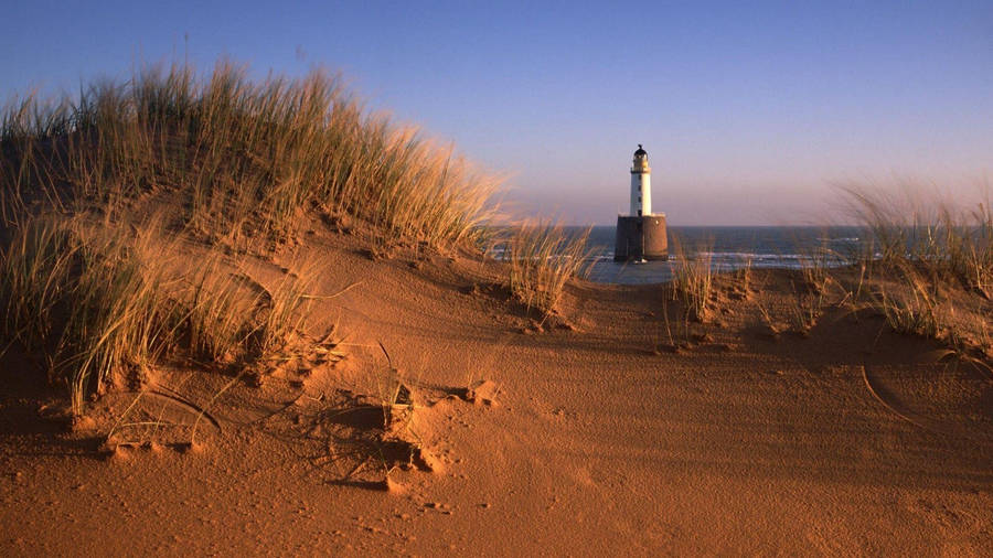 Lighthouse Between Dunes Wallpaper