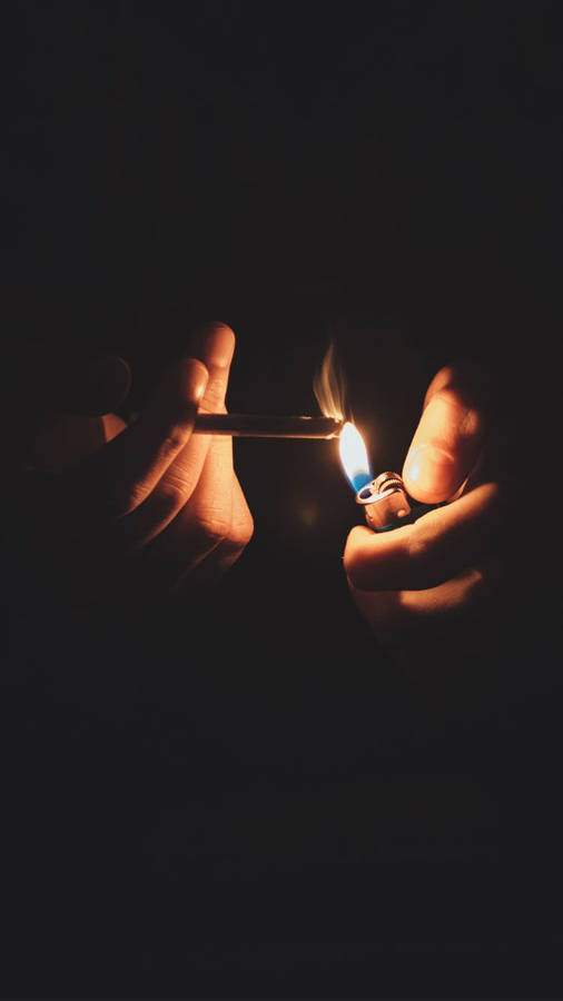 Lighting Cigarette In The Dark Iphone Wallpaper