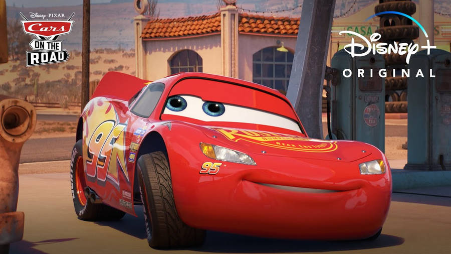 Lightning Mcqueen Speeding On The Race Track Wallpaper