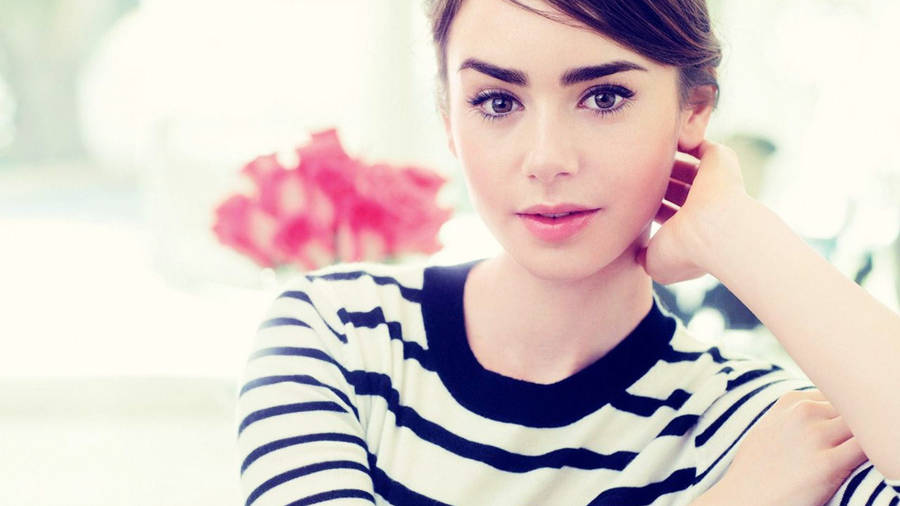 Lily Collins In Striped Top Wallpaper