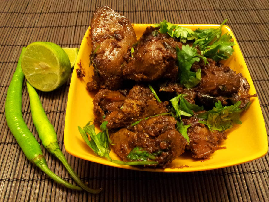 Liver With Basil Leaves On Yellow Plate Wallpaper