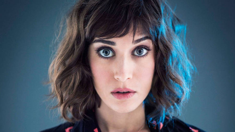 Lizzy Caplan With A Wide-eyed Look Wallpaper