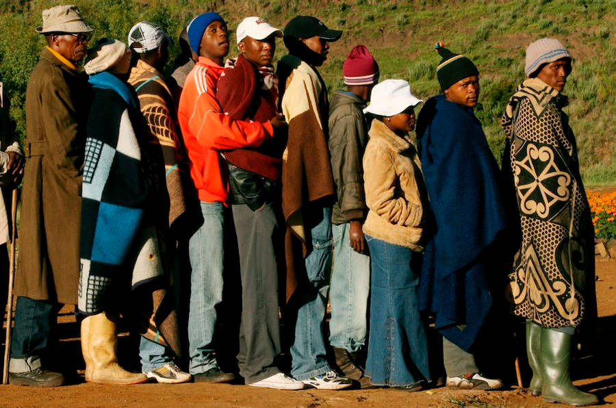 Local Lesotho Individuals In Caps And Jackets Wallpaper