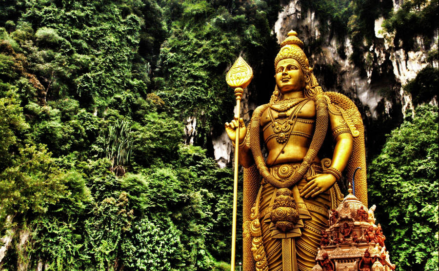 Lord Murugan 4k Statue With Trees Wallpaper