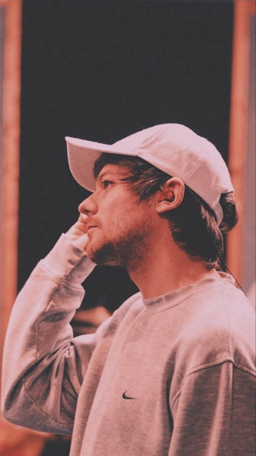 Louis Tomlinson Wearing A Cap Wallpaper