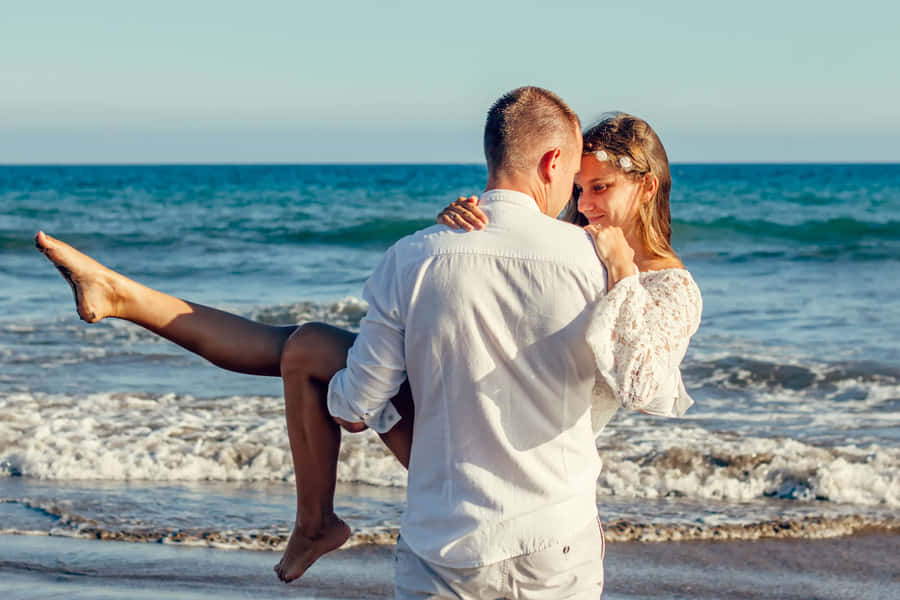 Lovers Carry Couple At Beach Wallpaper