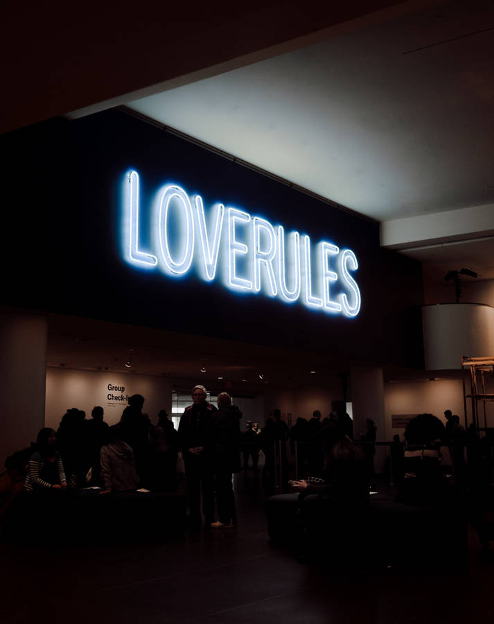 Loverules Signage In Neon Blue Iphone Wallpaper