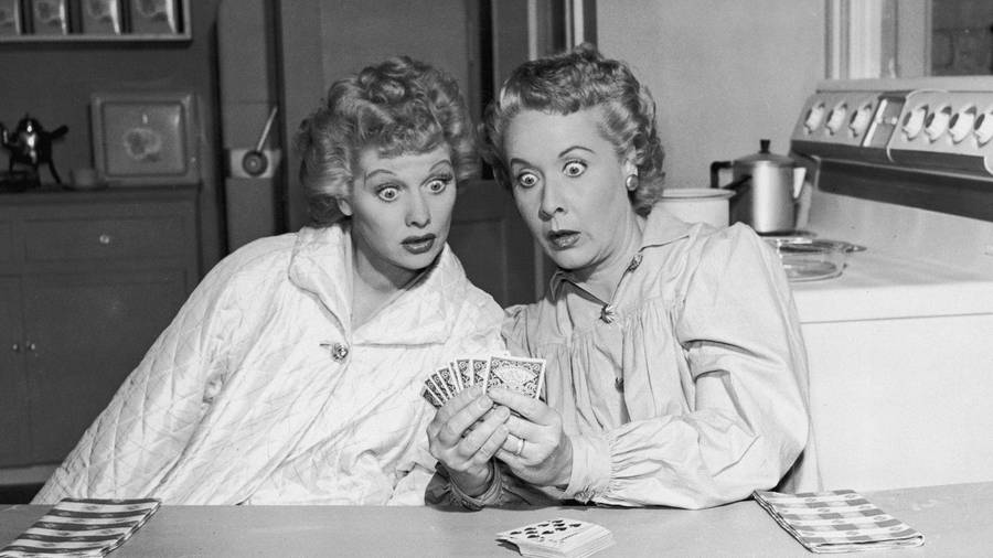 Lucille Ball And Vivian Vance Engaged In A Friendly Card Game Wallpaper