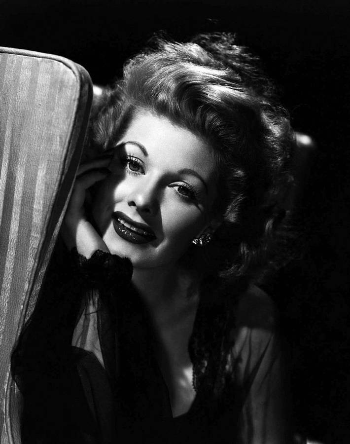 Lucille Ball Posing Behind A Mirror Wallpaper