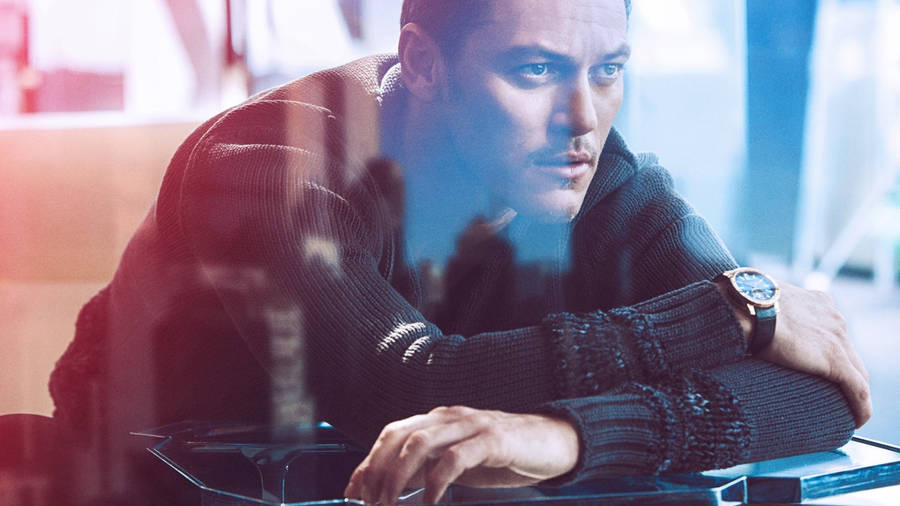 Luke Evans Window Reflection Wallpaper