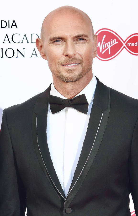 Luke Goss In A Suit And Ribbon Wallpaper