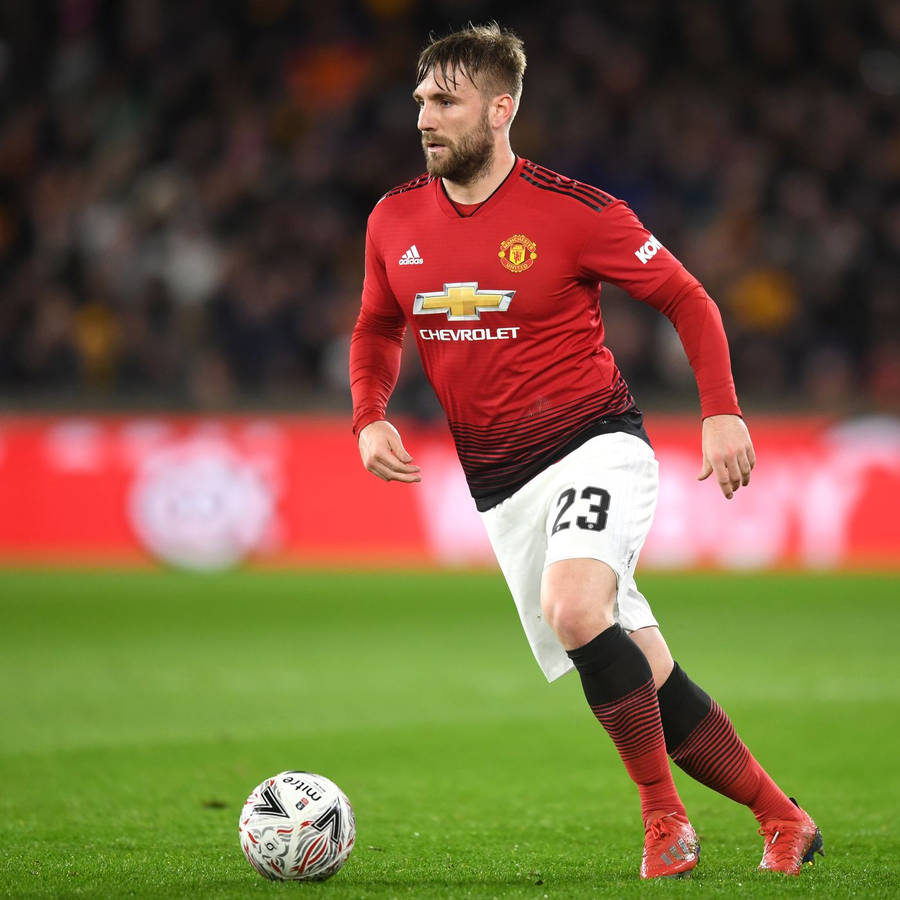 Luke Shaw Running With Football Wallpaper