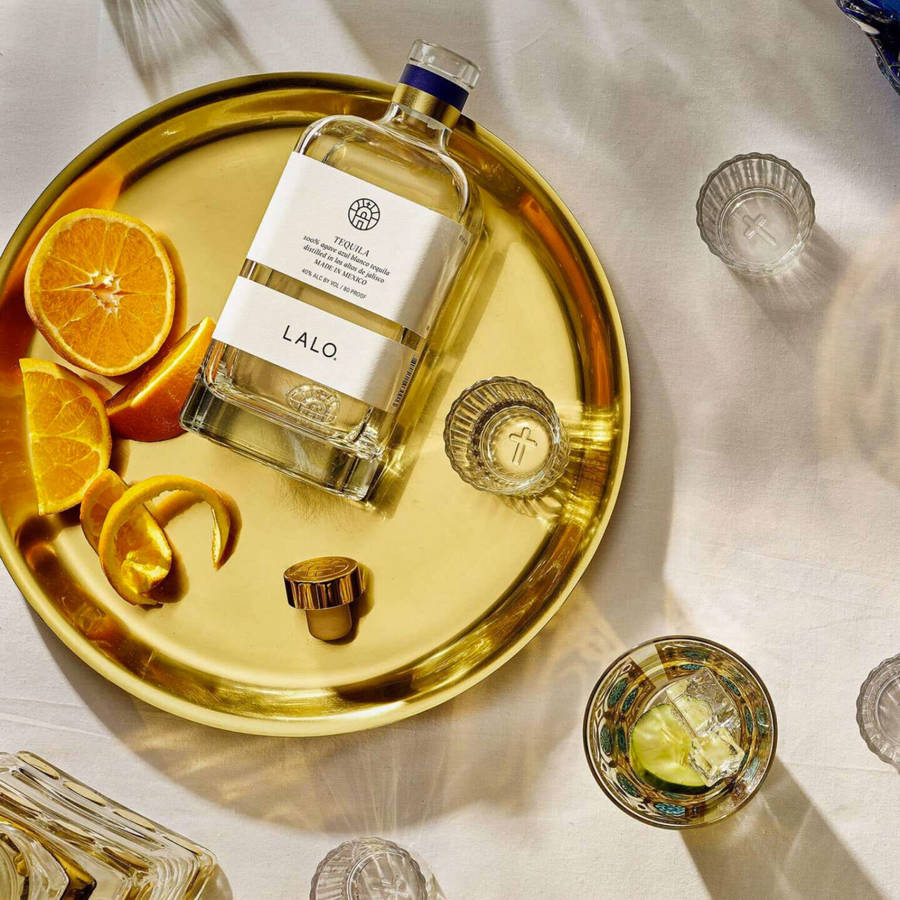 Luxurious Lalo Tequila Served On A Golden Plate Wallpaper