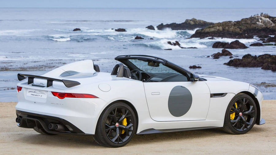 Luxurious Modern Jaguar Car On A Beach Wallpaper