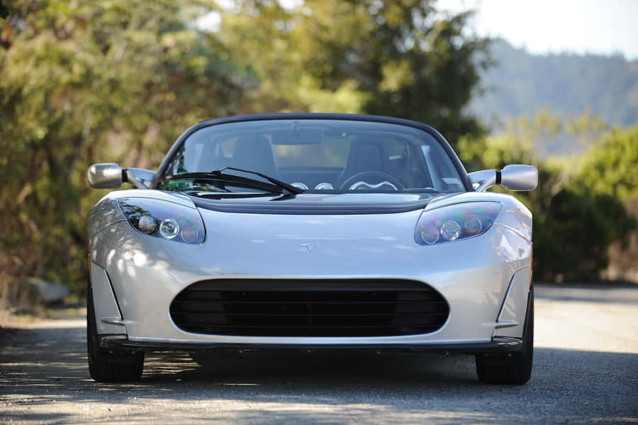 Luxurious Tesla Roadster - Innovation Meets Performance Wallpaper