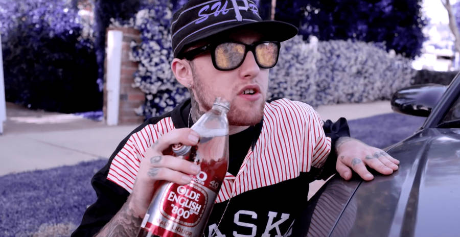 Mac Miller Holding Bottle Wallpaper