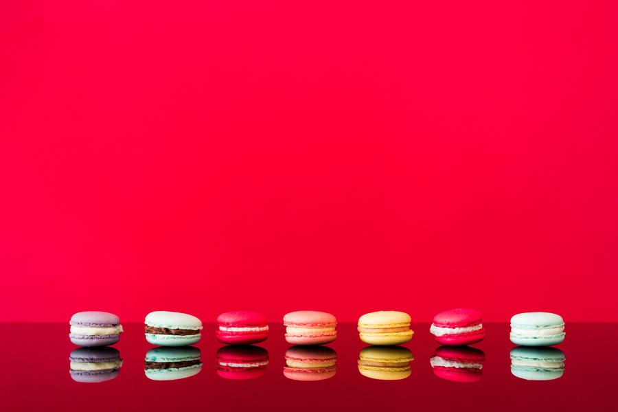 Macarons With Red Color Background Wallpaper