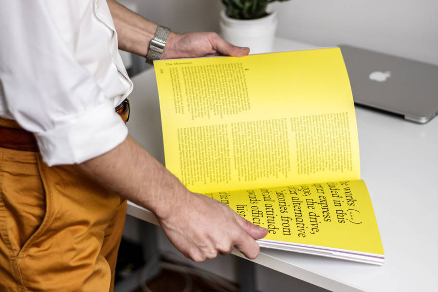 Magazine With Bright Yellow Pages Wallpaper