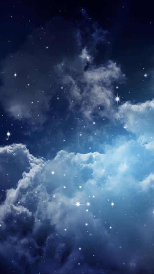 Magical Night Sky With Many Stars Shining On Large Clouds Wallpaper