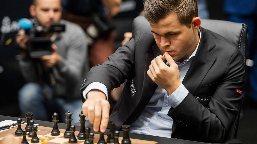 Magnus Carlsen Black Chess Pieces Wallpaper