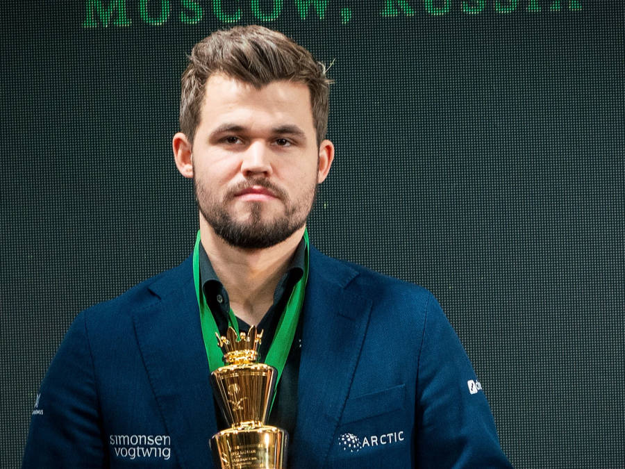 Magnus Carlsen Golden Trophy Wallpaper