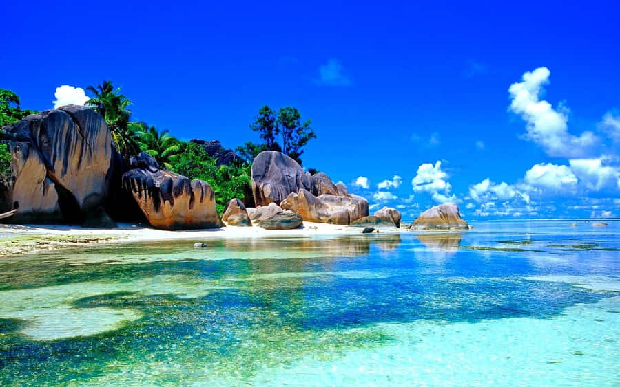 Majestic Beach Scene In Seychelles Wallpaper