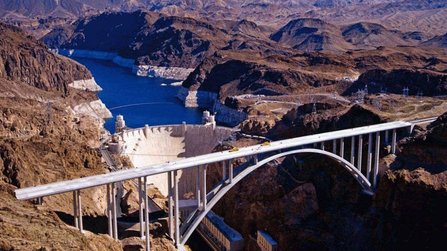 Majestic Hoover Dam Infrastructure With Bridge Construction Wallpaper