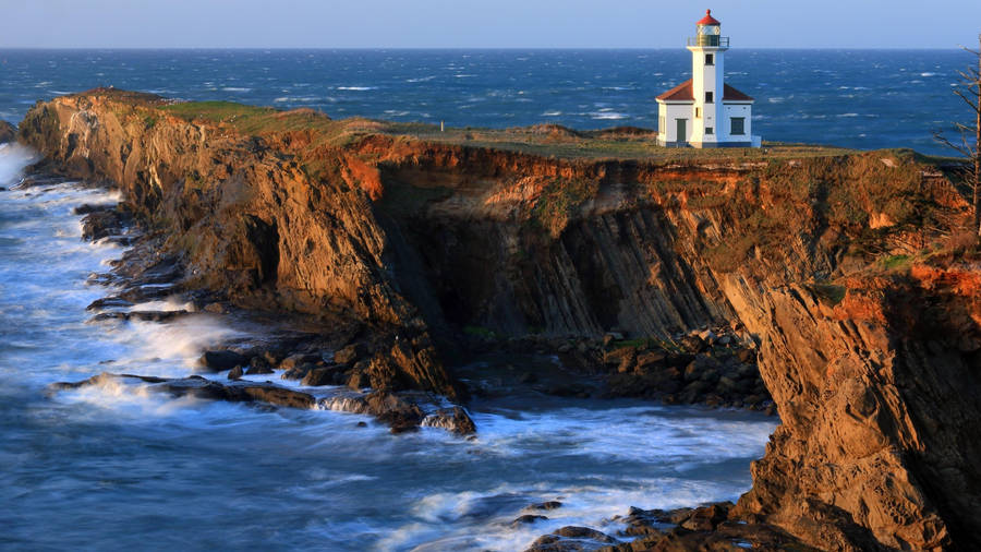 Majestic Lighthouse Standing Tall At Cape Arago, Oregon Wallpaper