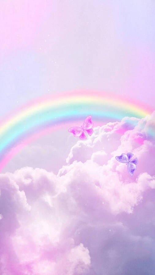 Majestic Rainbow Amidst The Clouds Wallpaper