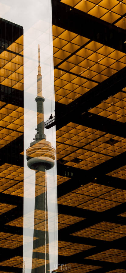 Majestic Reflection Of The Iconic Cn Tower Wallpaper