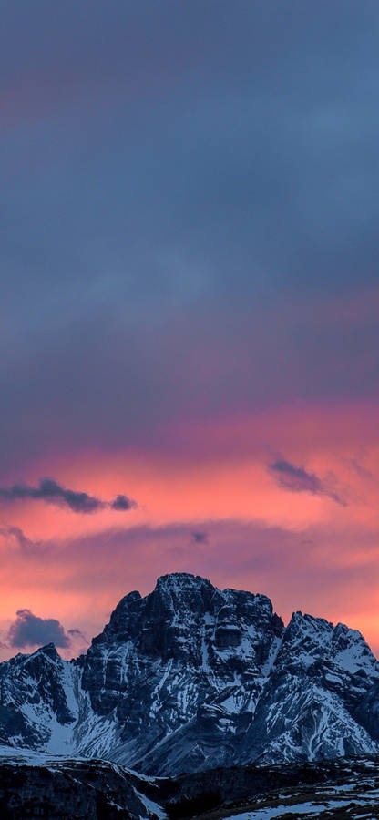 Majestic Snowy Mountain Range On Oled Iphone Wallpaper