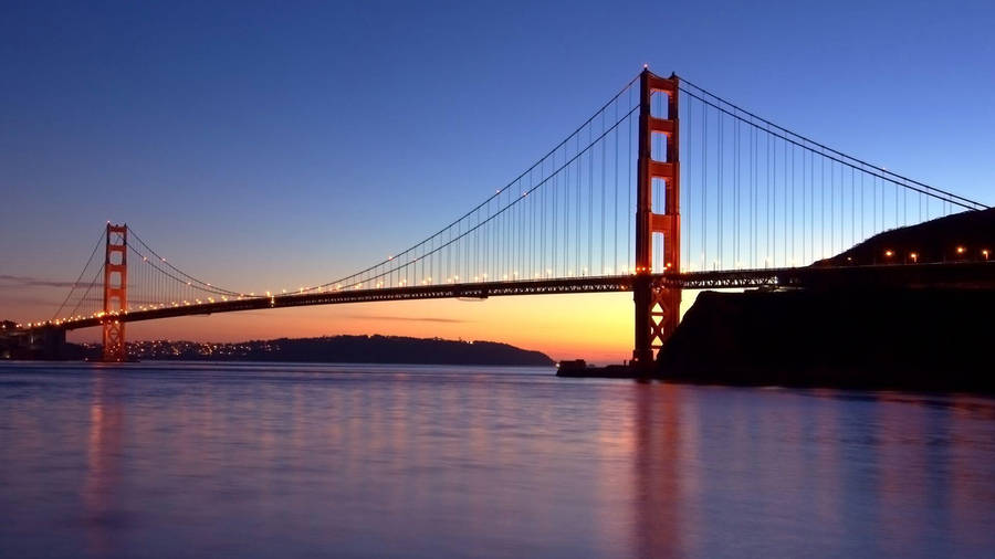 Majestic View Of The Golden Gate Bridge From The Water Wallpaper