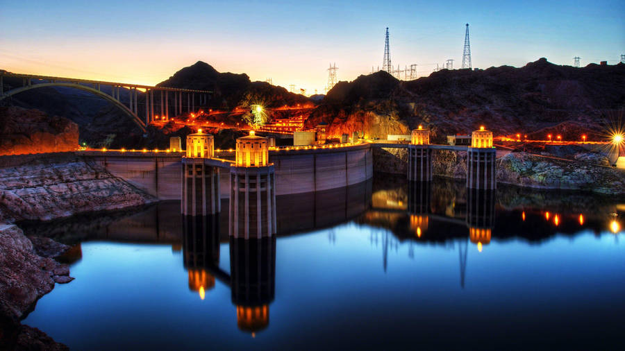 Majestic View Of The Hoover Dam With Stunning Reflections Wallpaper