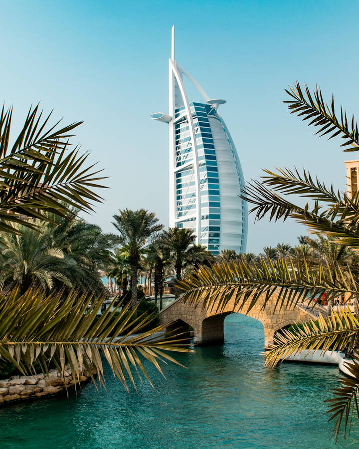 Majestic View Of The Iconic Burj Al Arab In Dubai At Sunset Wallpaper