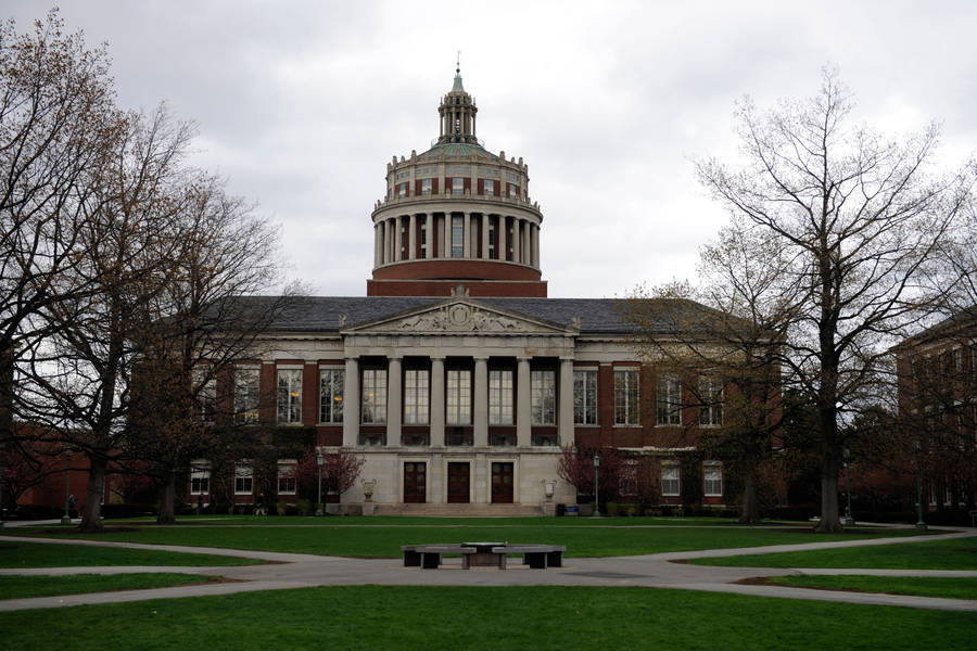 Majestic View Of The University Of Rochester Library Under A Gray Sky Wallpaper