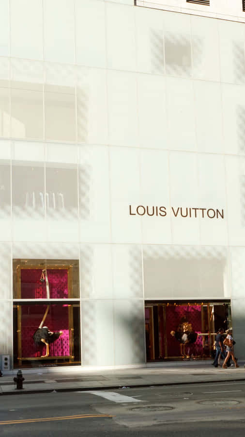 Make A Style Statement With This Glamorous Louis Vuitton Iphone Wallpaper