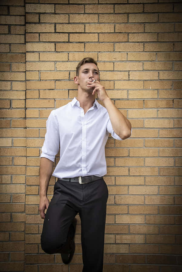 Male Model Smoking Brick Wall Wallpaper