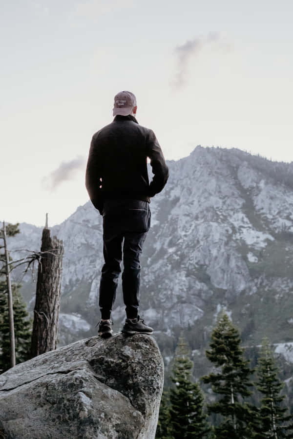 Male Person Standing On Rock Wallpaper