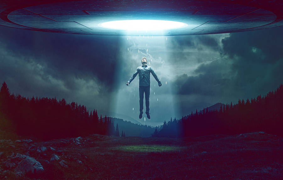 Man Ascending To Ufo Wallpaper