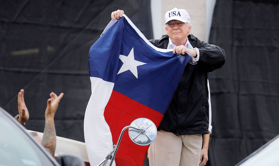 Man Holding Texas Flag Wallpaper