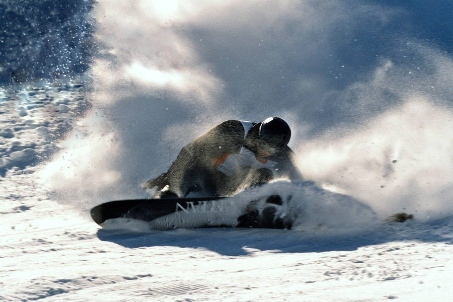 Man In Black With A Snowboard Wallpaper