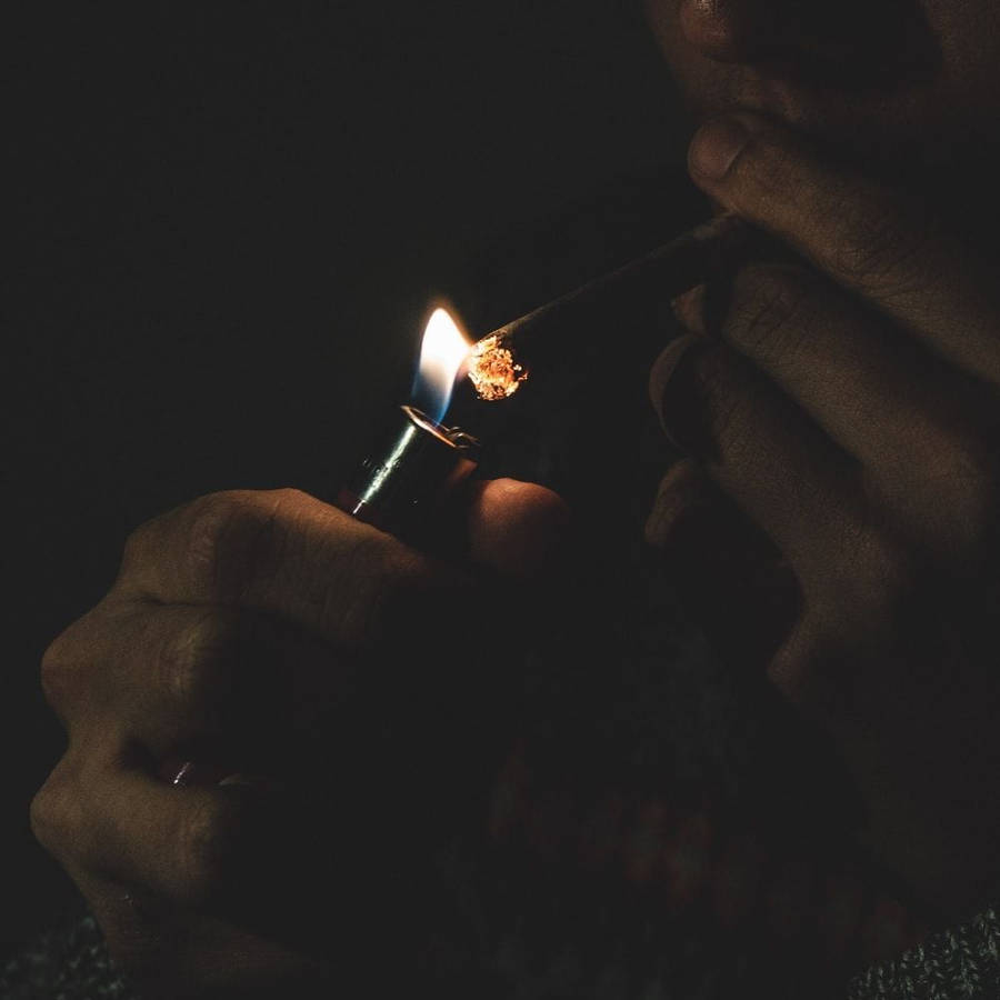 Man Lighting Up Blunt Wallpaper