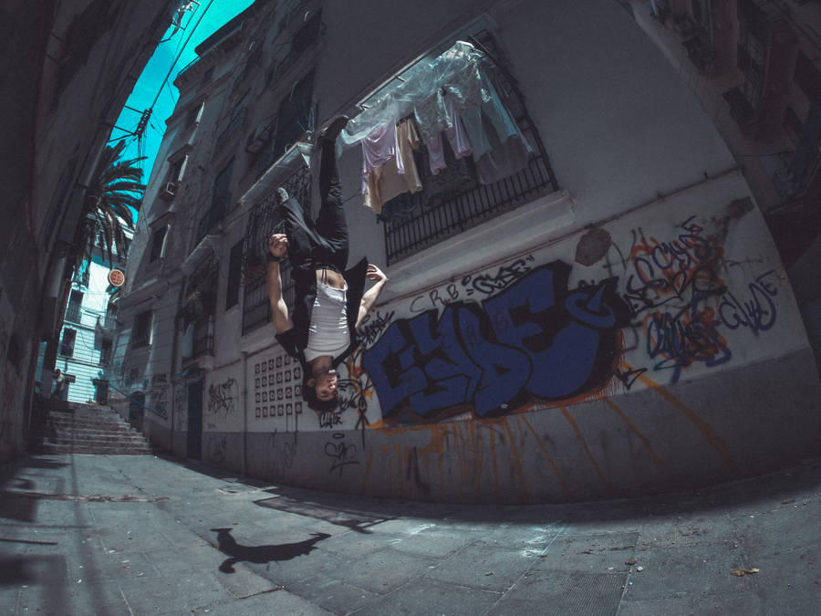 Man Performing Areal Parkour Wallpaper