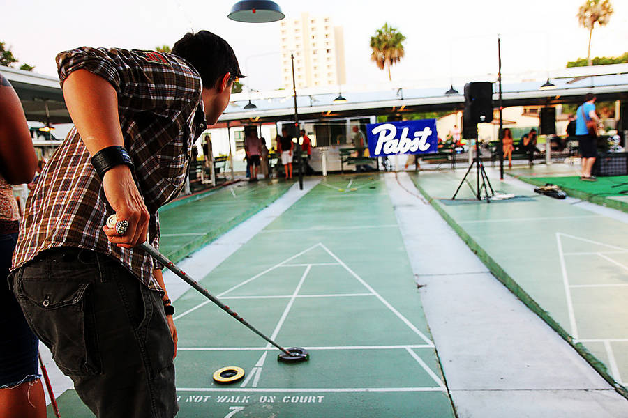 Man Playing At St. Pete Shuffleboard Club Wallpaper