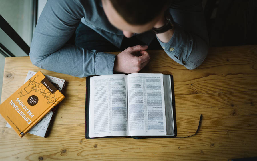 Man Reading Book High-angle Shot Wallpaper