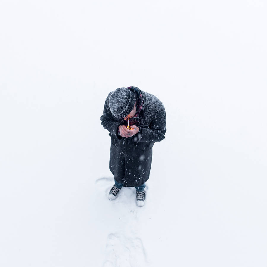 Man Smoking In Snow Wallpaper