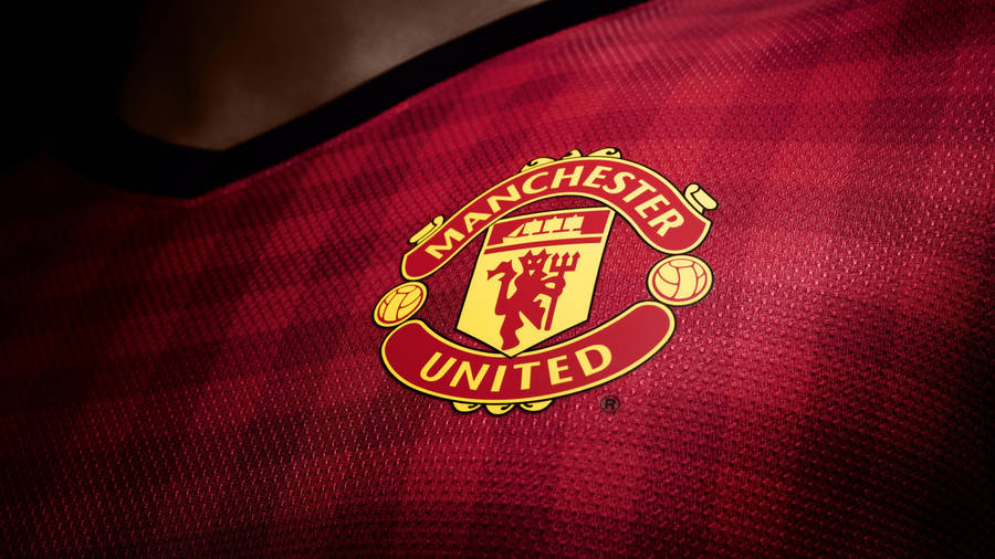 Manchester United Logo On Red Jersey Wallpaper