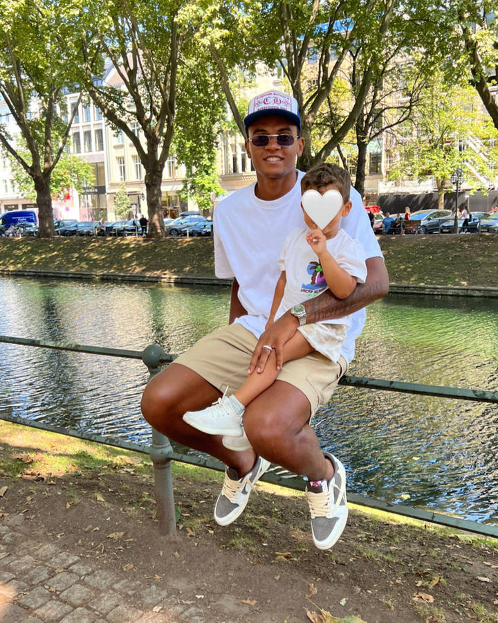 Manuel Akanji Sitting On The Railing Wallpaper